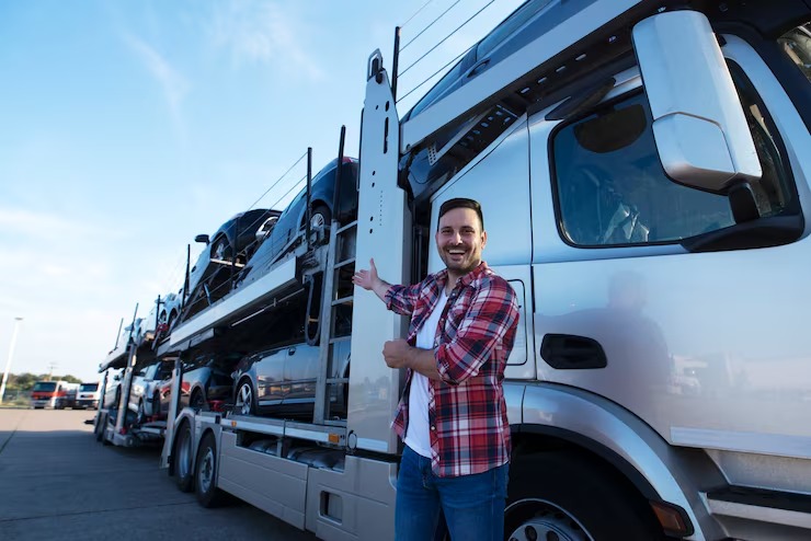 imgi_65_middle-aged-trucker-front-truck-trailer-with-cars_342744-1283